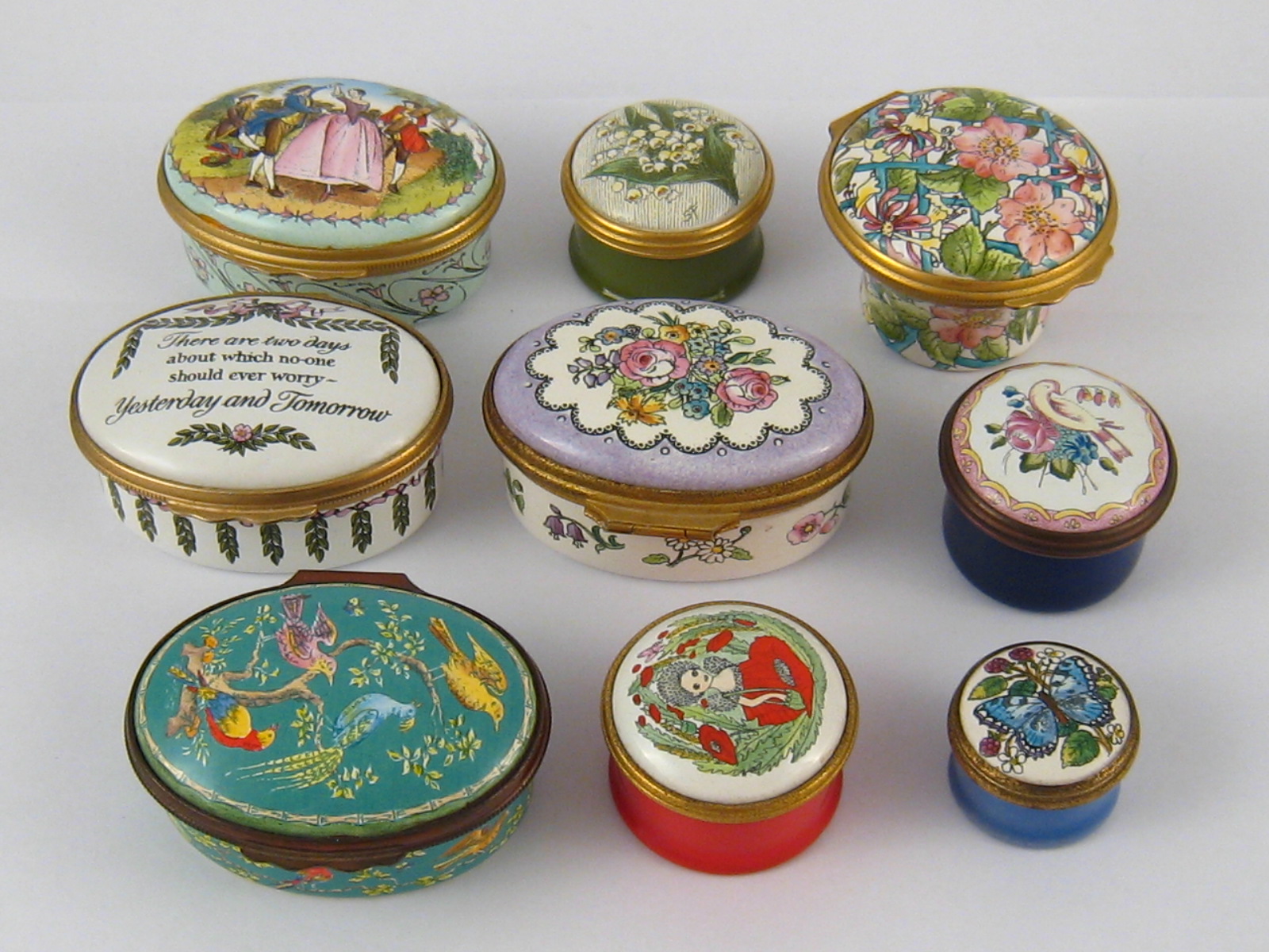 A collection of eight Halcyon Days enamel boxes, including one musical box.