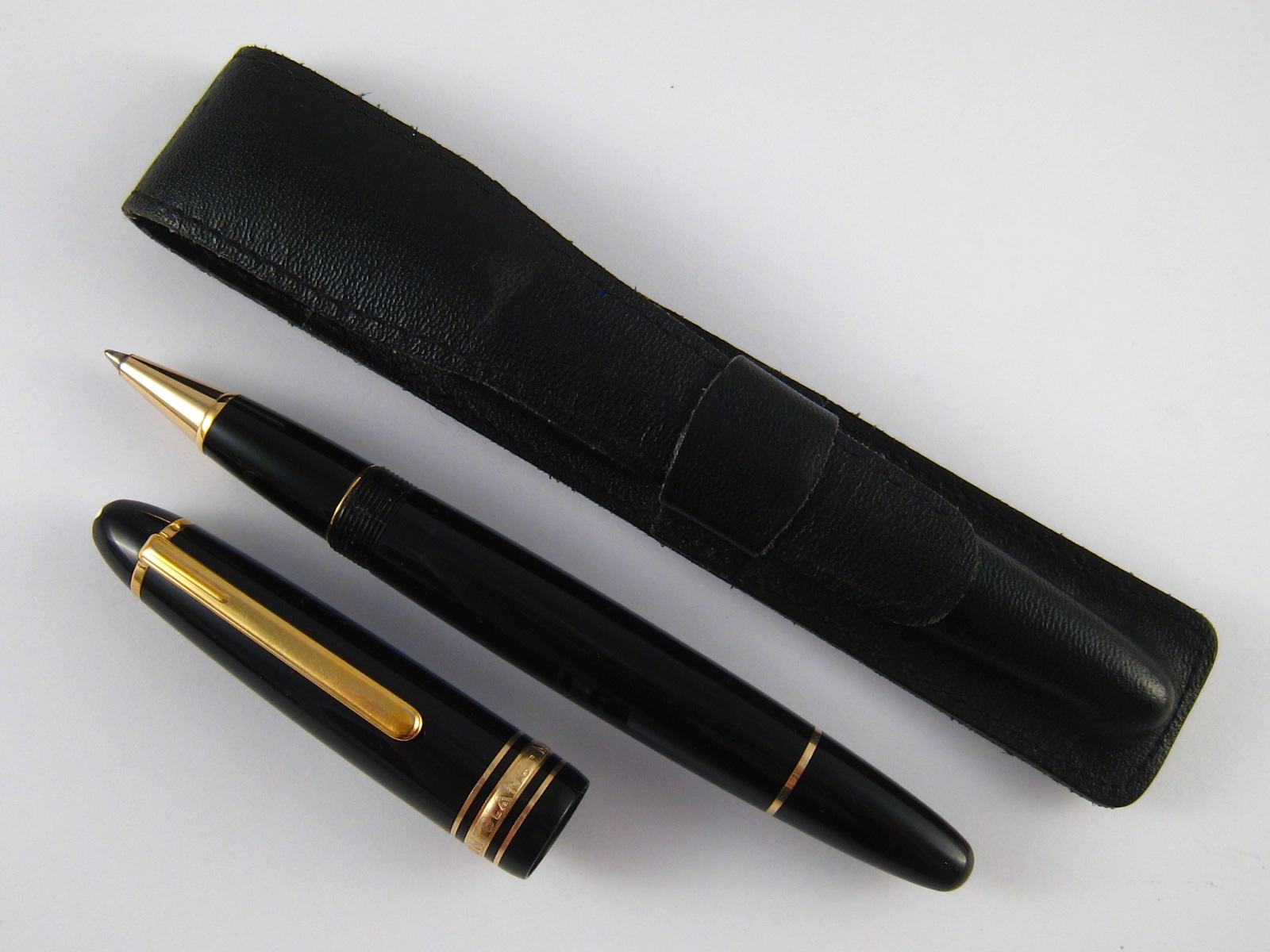 A Montblanc Meisterstuck ballpoint pen with engraved initilas AG, in leather case.