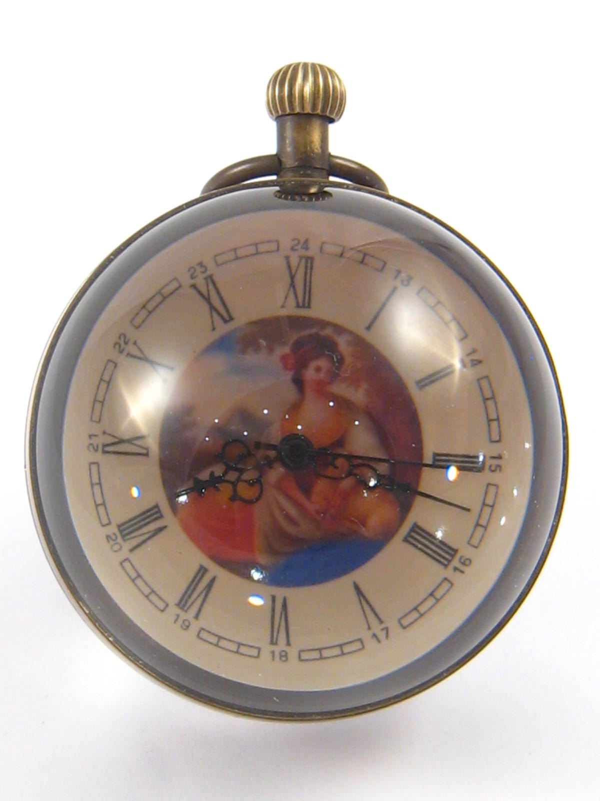 An anodised brass mounted glass ball button wind clock with central picture of a lady,