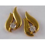 A pair of 18 carat gold diamond earrings, approx 1cm, 1.7 gms.