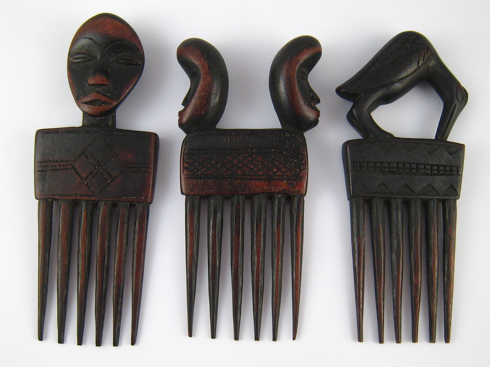 Tribal Art . Three hardwood combs, Dan tribe, Ivory coast.