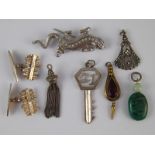 A mixed lot including a pair of white metal (tests silver) cufflinks and a similar 21st key pendant.