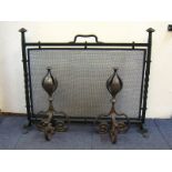 A pair of heavy wrought iron Arts & Crafts firedogs and firescreen. Firedogs ht. 40cm.
