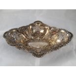 A shaped deep oval pierced and embossed late Victorian silver dish by Elkington & Co.
