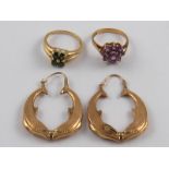 A mixed lot comprising two 9 carat gold rings and a pair of 9 carat gold earrings,