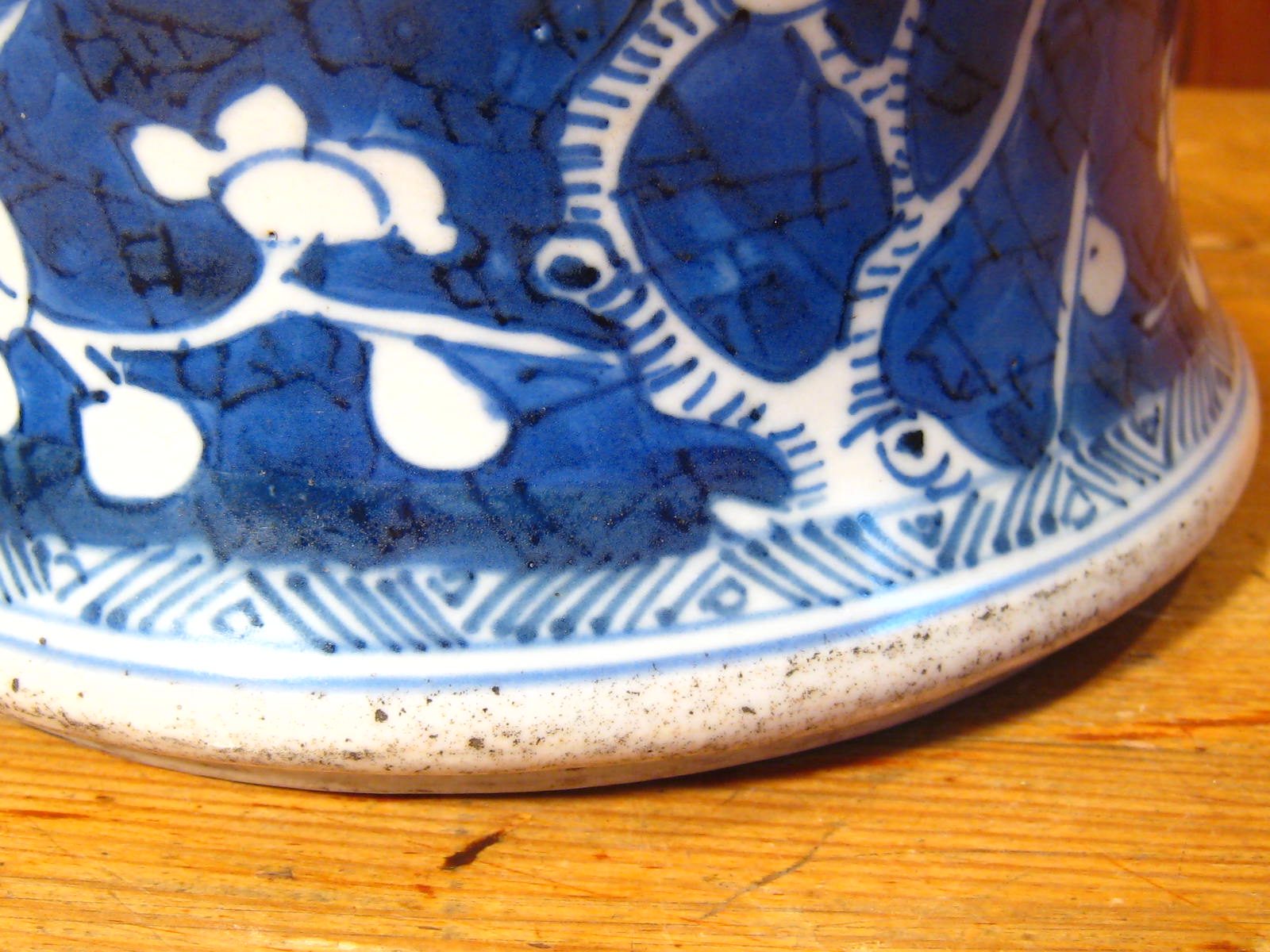 A Chinese squat baluster vase, circa 1700, with prunus on cracked ice. Repair to rim. 20cm. across. - Image 5 of 11