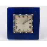 A French hallmarked silver and lapis lazuli clock, with gold, silver and enamel bezel and diamond