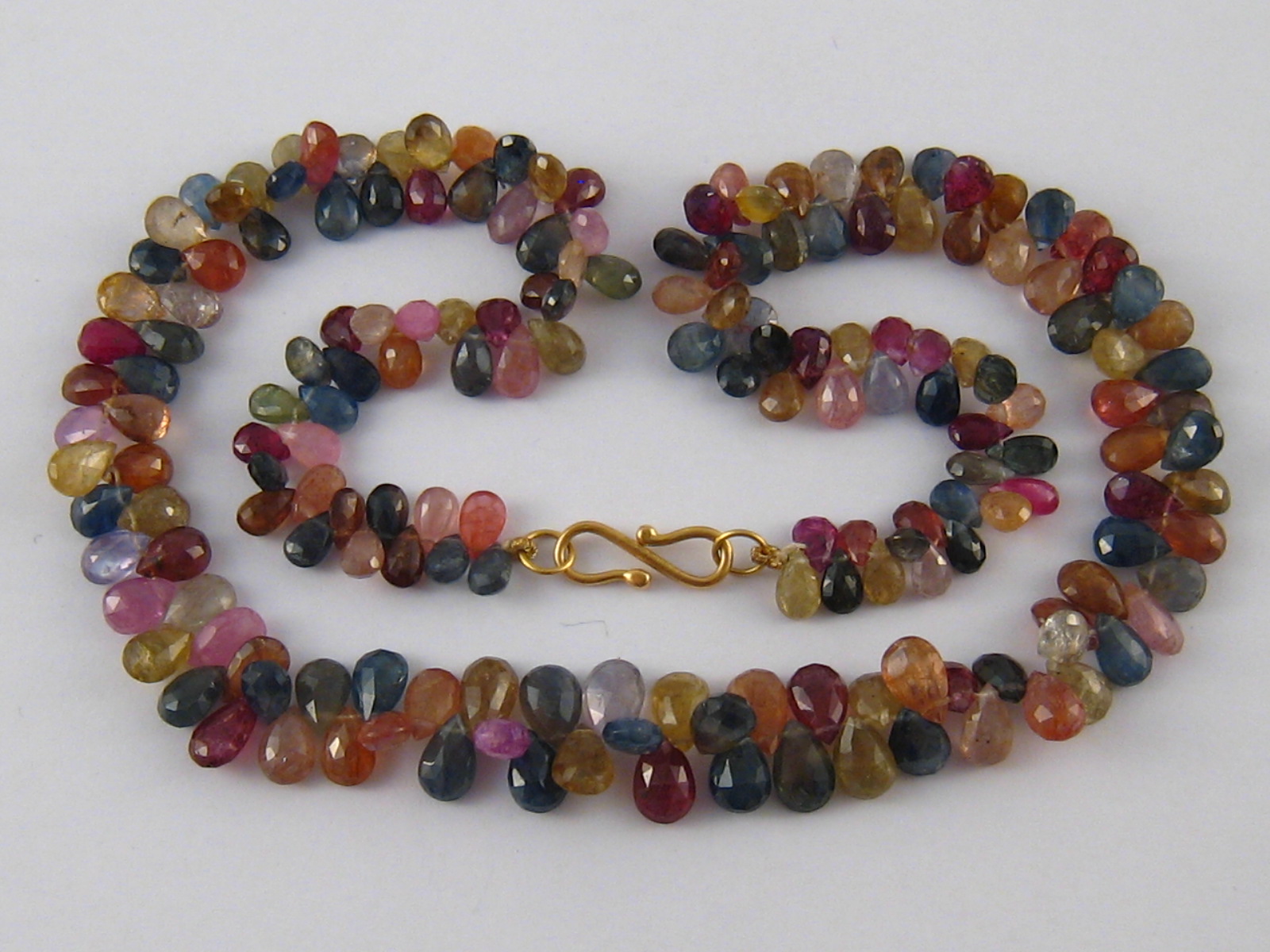 A multi gem necklace with yellow metal (tests 18 carat gold) clasp, necklace approx 40cm long.