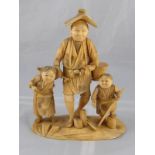 A carved Oriental sectional ivory group of a peasant with two children, circa 1920. ht.19cm.