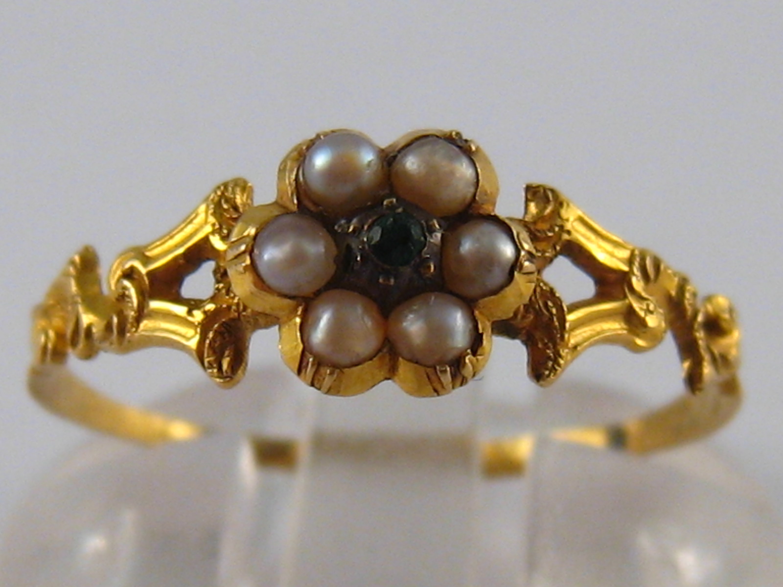 A yellow metal (tests 18 carat gold) seed pearl ring, size Q, weight  1 gm.