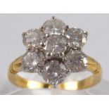 An 18 Carat gold seven stone round brilliant cut diamond ring,