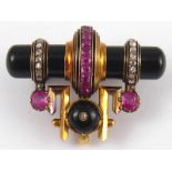 A French hallmarked 18 carat gold, onyx, diamond, ruby and black enamel Art Deco brooch,