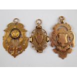 A mixed lot comprising three 9 carat gold medals,