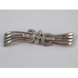 A white metal (tests 18 carat gold) diamond brooch, approx 5.5cm, 8.3 gms.