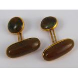 A pair of yellow metal (tests 18 carat gold) jade cufflinks,