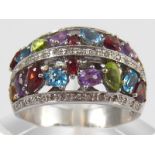 A white metal (tests 18 carat gold) “tutti frutti” multi gem ring, approx 52mm wide, ring size Y,