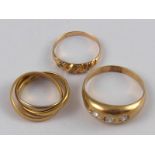 A mixed lot comprising a three colour metal (tests 18 carat gold) “Russian wedding ring”, (5.