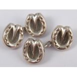 A pair of antique English silver cufflinks, designed as horse shoes, hallmarked London 1888,