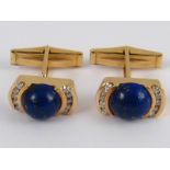 A fine pair of yellow metal (tests 18 carat gold) lapis lazuli and diamond cufflinks, marked 18k,