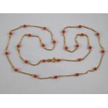 A yellow metal (tests 18 carat gold) coral bead necklace, approx. 74cm long, 6.6 gms, beads approx.