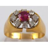 An 18 carat gold ruby and diamond ring, the ruby of good colour measuring approx. 4.7 x 4.