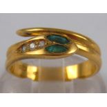 An 18 carat gold emerald and diamond snake ring, size L, 3.5 gms.