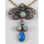 An Edwardian opal and diamond pendant on a gold chain,  and set with opals and diamonds,