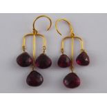 A pair of yellow metal (tests 18 carat gold) garnet earrings, drop approx 5cm, 8.1 gms.