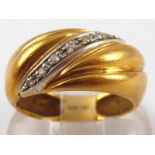 A yellow metal (tests 18 carat gold) diamond ring, size M, 4.7 gms.