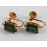 A pair of screw fit yellow metal (tests 18 carat gold) green tourmaline and diamond earrings,