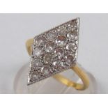 A yellow and white metal (tests 18 carat gold) marquise shape diamond cluster ring,