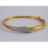 An 18 carat gold pave set diamond bangle, internal width approx 53mm width of bangle approx 6.