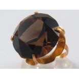 A yellow metal (tests 14 carat gold) smokey quartz ring, quartz approx 19mm diameter, size M, 8.