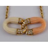 A yellow metal (tests 18 carat gold) pink and white coral and diamond pendant necklace,