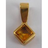 A yellow metal (tests 18 carat gold) citrine pendant, approx 2cm, 1.8 gms.