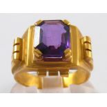 A yellow metal (tests 18 carat gold) faceted amethyst ring, amethyst approx 10 x 8mm, ring size N ½,