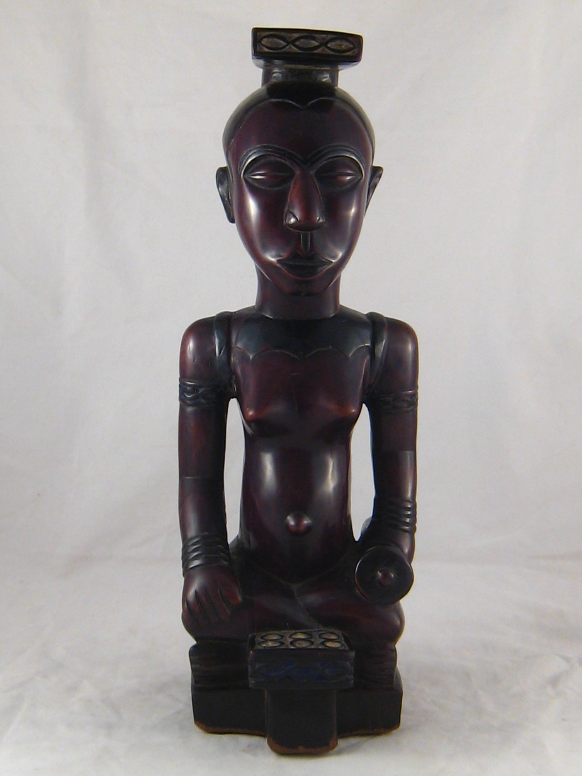 A Lubu tribe, Congo, carving in very dense African hardwood of a seated woman. ht.43cm.