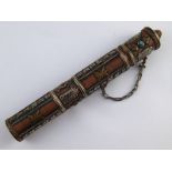 An Eastern brass scroll holder, possibly Tibetan,