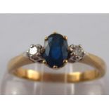 A 9 carat gold sapphire and diamond ring, size N, 2.5 gms.