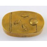 An antique oval brass box with combination lock of three dials. 8x5cm.