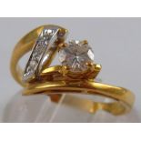 An 18 carat gold diamond ring, the principal round brilliant cut diamond measuring approx. 4.7 x2.