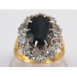 An 18 carat gold sapphire and diamond ring, sapphire approx 11 x 8mm,