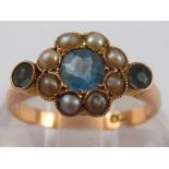 An antique 9 carat gold aquamarine and seed pearl ring, the principal aquamarine measuring approx.
