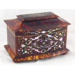 A tortoiseshell bow fronted tea caddy with pagoda lid, lock and key,