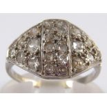 An Art Deco white metal (tests 18 carat gold) old brilliant cut diamond ring, size M, 2.5 gms.