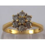 An 18 carat gold diamond cluster ring, estimated diamond content approx 0.