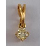 A yellow metal (tests 18 carat gold) diamond solitaire pendant,