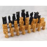 A carved Chinese wooden chess set. Ht. queen. 10cm.