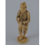 A Japanese sectional bone carving of a peasant with pipe, fruit and basket. ht.14cm.