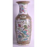 A LARGE 19TH CENTURY CHINESE CANTON FAMILLE ROSE VASE painted with figures within interiors and